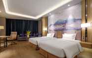 Kamar Tidur 6 Days Hotel by Wyndham Guangzhou Hantian