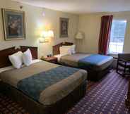 Bedroom 3 Ozark Inn & Suites