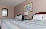 ห้องนอน 6 Apm Inn & Suites