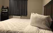 Bedroom 2 Travelodge by Wyndham London Ontario