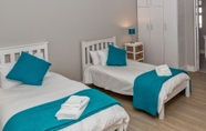 Bedroom 4 Gansbaai Seafront Holiday House: Ons C-huis