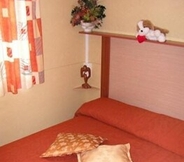 Bedroom 7 Villaggio Camping Orchidea