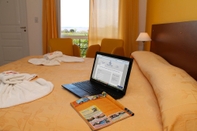 Kamar Tidur Brisas del Lago Apart & Hotel Federacion