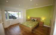 Bedroom 6 Four Corners Holiday Home with Hot Tub & Sauna