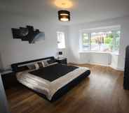 Bedroom 2 Four Corners Holiday Home with Hot Tub & Sauna