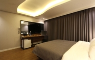 Bilik Tidur 4 Asome Hotel