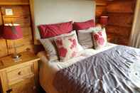 Kamar Tidur Newland Valley Log Cabins