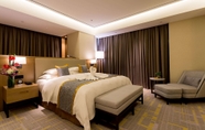 Bedroom 5 Howard Johnson by Wyndham Glory Plaza ChengHai