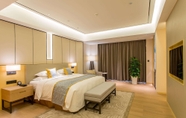 Bedroom 4 Howard Johnson by Wyndham Glory Plaza ChengHai