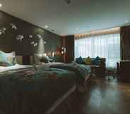 Kamar Tidur 3 Tulip Inn Huaxi Hotel - Guiyang