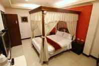 ห้องนอน Mi Casa Inn