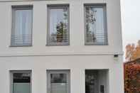 Exterior Grey House Apartments Grossbeeren