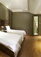 BEDROOM โรงแรมกรีนทรีอินน์ สถานีรถไฟความเร็วสูงอู่ฮั่น