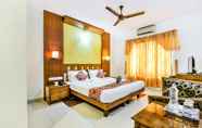 Bedroom 5 FabHotel Kangappadan Residency