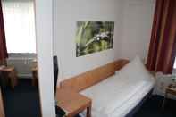 Bedroom Hotel Römerhof by Trip Inn