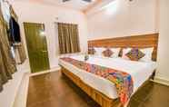 Bedroom 7 FabHotel Radha Residency