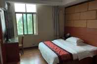 Bedroom Puqian Business Hotel