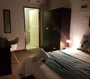 Kamar Tidur 5 Izinga Guest House