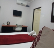 Kamar Tidur 7 Izinga Guest House