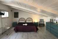 Phòng ngủ Centro Storico Alghero B&B