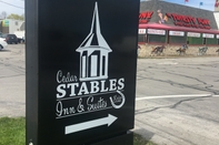 Exterior Cedar Stables Inn and Suites