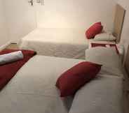 Kamar Tidur 7 Cape Capsules Back Packers & Pizzeria