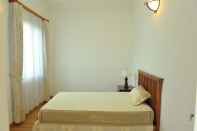 Kamar Tidur Coco Flower Village Serviced Apartment