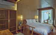 ห้องนอน 5 Lijiang Qilu Garden Hotel