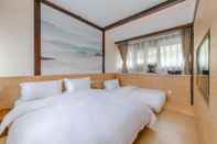 ห้องนอน Lijiang Qilu Garden Hotel