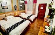 ห้องนอน 2 Fenghuang Little Bear Family Guest House