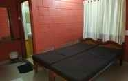 Kamar Tidur 7 Iroomz Savitri Guest House