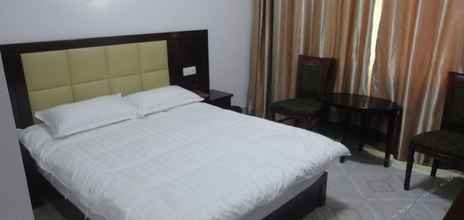 Kamar Tidur 4 Youyi Business Hotel