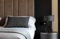 Bedroom Amadomus Luxury suites