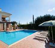 Swimming Pool 2 3 bedroom Villa Anarita 64 with private L-shaped pool, beautiful gardens, near resort village square