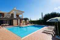 Swimming Pool 3 bedroom Villa Anarita 64 with private L-shaped pool, beautiful gardens, near resort village square