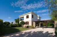 Exterior 3 bedroom Villa Anarita 64 with private L-shaped pool, beautiful gardens, near resort village square