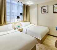 Bedroom 6 Jiangxia Business Hotel