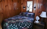 Bedroom 6 #1 - Cedar Village 2 Bedroom Cabin by RedAwning