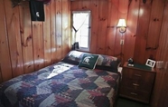 Bedroom 5 #1 - Cedar Village 2 Bedroom Cabin by RedAwning