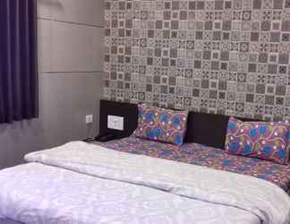 Kamar Tidur 2 Sharmin Rose Bungalow by Sky Stays