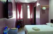 Kamar Tidur 7 Purple Dream Homestay