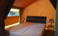 Bedroom 4 Camping Le Petit Lion - Tente Safari