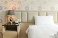 ห้องนอน Champs Elysees Hotel