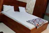 Bedroom Hotel Nirmala Residency