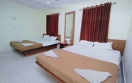 Phòng ngủ 2 Rajhuns Deluxe Lodging