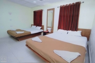 Phòng ngủ Rajhuns Deluxe Lodging