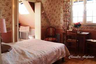 ห้องนอน 4 Chambres d'hotes de la Ville Patouard