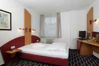 ห้องนอน Stadthotel Kassel