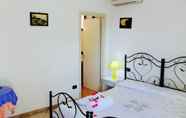 Kamar Tidur 6 Amoru Bed & Breakfast