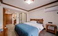 Bilik Tidur 5 Xijiang Village Vision Hotel